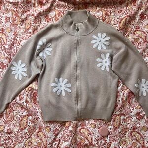 Beige Sweater with White Floral Design
